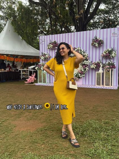 "Who needs a sunflower? I am here." A bright and cheerful look in a yellow knit dress at an outdoor event. This outfit is perfect for daytime functions, radiating positivity and style.
