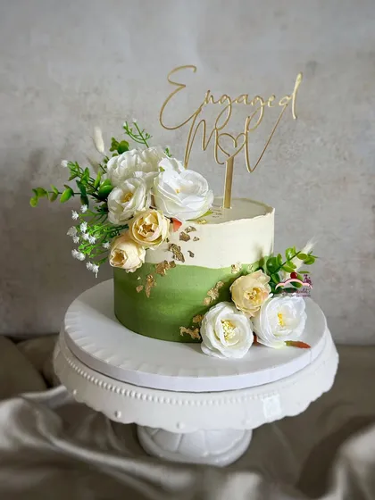 Another view of this green and ivory engagement cake, showing how a touch of color can make a classic design feel fresh and modern.
