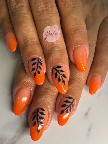 A beautiful orange ombre set with delicate, hand-painted black leaves.
