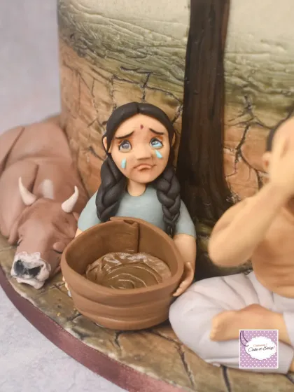 A detailed shot of the weeping child with an empty basket from the 'Adharma' side. It's these small, emotional details that I believe make a cake truly memorable and turn it into edible art.