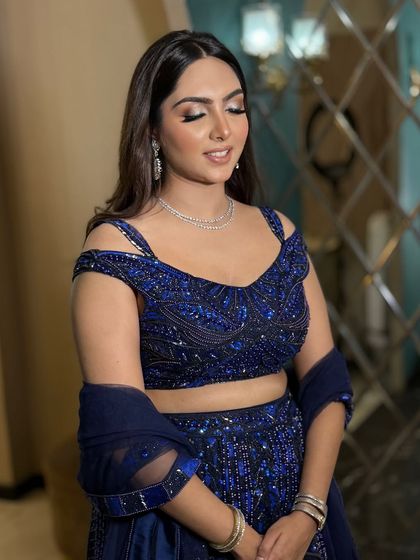 Eyes closed to show the beautiful blend of the eyeshadow. The look is polished and sophisticated.