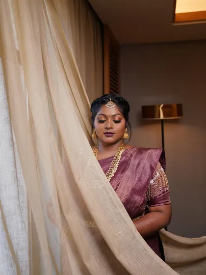 Dr. Preetha's engagement look, captured beautifully. The makeup was designed to be dramatic yet elegant, perfect for the occasion.