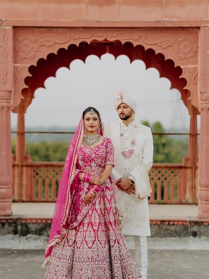 A formal portrait of us on our wedding day. We chose traditional outfits that reflected our culture and the solemnity of the occasion.