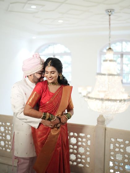 A sweet and intimate portrait of the groom hugging the bride from behind. A classic pose that always looks beautiful.