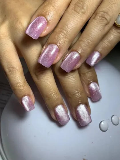 A simple yet stunning shimmery pink cat eye design. This look is perfect for everyday wear, adding a touch of glamour without being over the top.