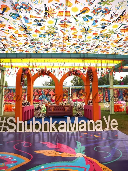 The full view of our fun carnival decor, complete with a custom printed ceiling fabric. This setup is guaranteed to get the party started.