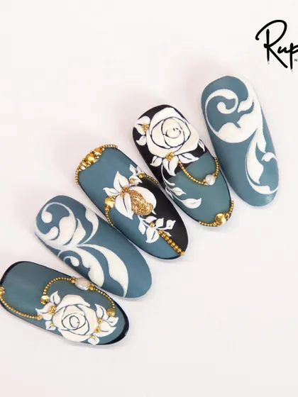 A top-down view of the elegant blue, white, and gold bridal designs.