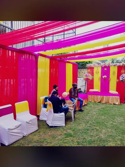 A wider view of the garden setup for a Mehandi night. We create a complete tented enclosure with fabric draping on the sides and ceiling, along with seating for guests.