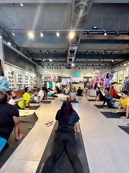 A yoga session with the running crew inside the Adidas store. We focus on holistic fitness, including flexibility and mobility, to support our running.