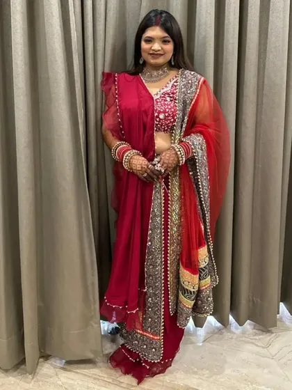 Another shot of this gorgeous festive look. The simple, open hairstyle is perfect for balancing a detailed outfit and heavy jewelry.