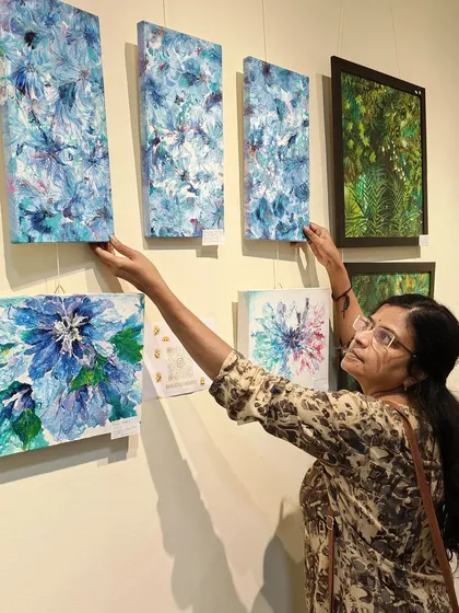 Hanging up my paintings at the gallery.