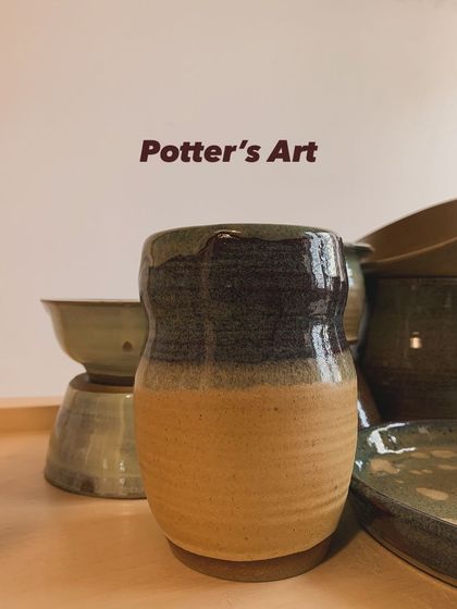 A close-up of a two-toned vase, part of a larger collection. The contrast between the glossy and matte glazes is one of my favorite techniques.