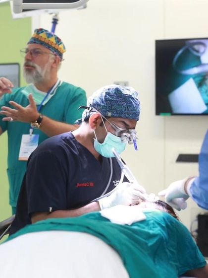 Here, I am working alongside Dr. Anastasios Vekris during a live surgery demonstration in Bangkok. Collaborating with international experts enriches the learning experience for all participants.