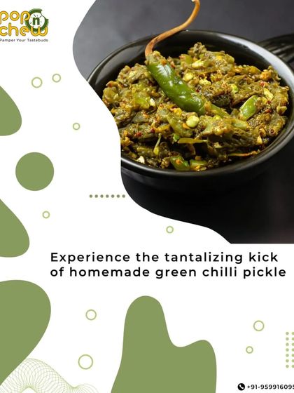 A bowl of our zesty green chilli pickle, ready to be served. You can see the texture of the chopped chillies and spices, promising a tantalizing kick for all spice enthusiasts.