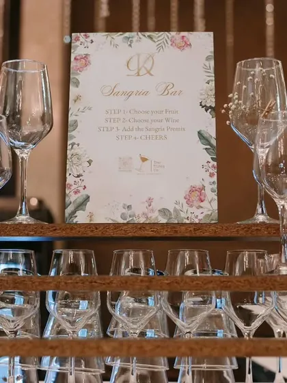 A beautifully arranged Sangria Bar. We provide a variety of elegant glassware and a custom menu guiding guests on how to create their perfect glass of sangria, making it an interactive and fun station.