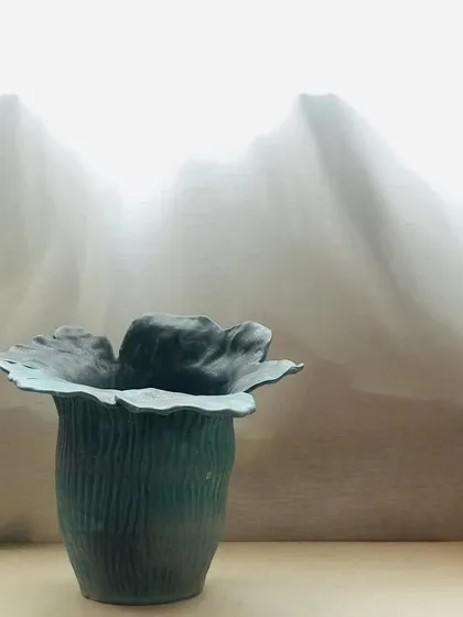 The beautiful, organic form of the Wild Petal Vase, a piece where nature's spontaneity takes shape in clay.