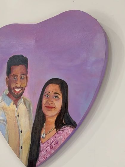 A slightly different angle of the heart-shaped portrait, showing the soft purple background that complements the couple's features. Creating personalized gifts like this is incredibly fulfilling.