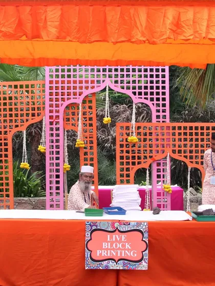 We set up a live block printing station where guests could customize dupattas and bags. It's a fun, engaging activity that allows guests to create their own unique favor and learn about a traditional craft.