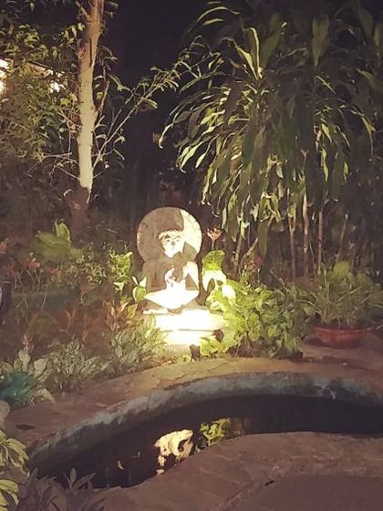 This is how a garden water feature looks at night. I use subtle, waterproof spotlights to illuminate the statue and surrounding plants, creating a mysterious and enchanting focal point in the darkness.
