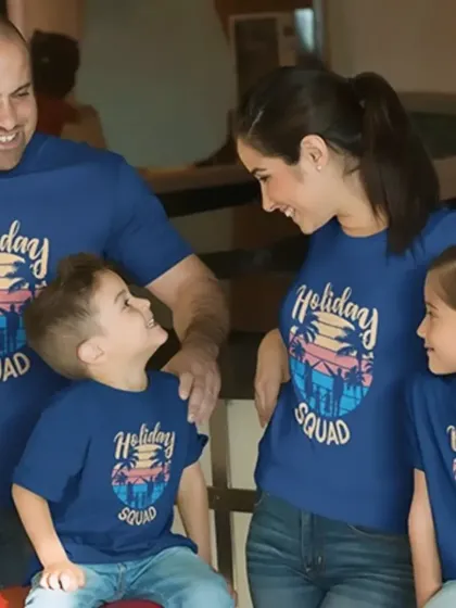 The "Holiday Squad" is ready for fun in these matching royal blue t-shirts. Perfect for family trips, these tees feature a vibrant sunset design that sets the vacation mood.