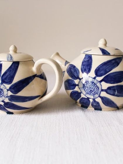 A pair of my Bloom & Brew teapots, each with its own hand-painted floral personality. They are crafted to be the centerpiece of a slow, relaxing tea ritual.