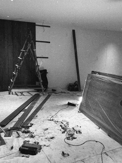 A candid shot from a site, coming together quite well. This black and white image captures the reality of the construction process, with tools and materials part of the scene.