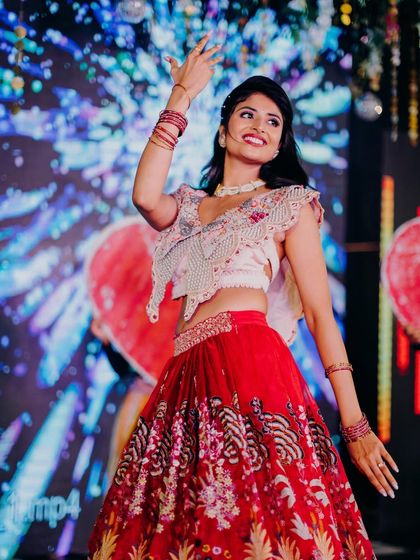 A dynamic shot of the bride dancing at her Sangeet. The makeup is designed to be sweat-proof and long-lasting, perfect for an energetic performance.