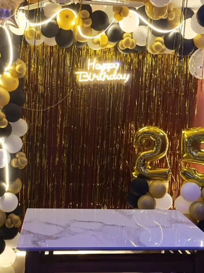 A closer look at the 25th birthday home setup, ready for a cake-cutting ceremony.