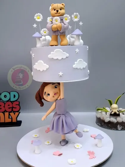 This whimsical anti-gravity cake was the final project for a student in my 6-day Cake Business Reboot Masterclass. She learned everything from animal and human figurines to the complex structure holding it all together.