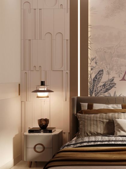 A close-up of the bedside area, showing the textured wall panels, a modern pendant lamp, and a chic side table.