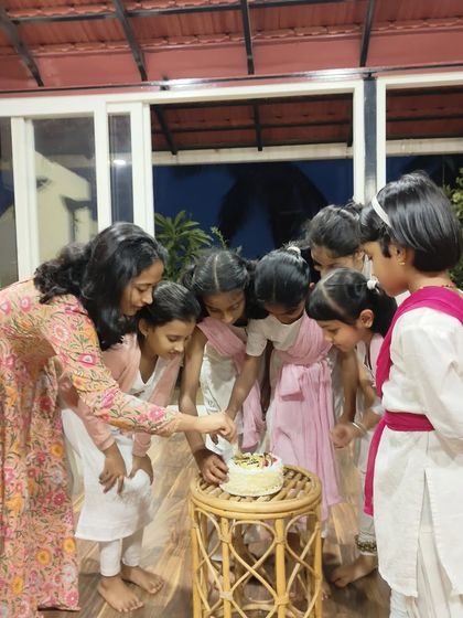 The best part of any celebration is sharing it with my kids. This is a sweet moment of them gathered around to cut the Teacher's Day cake.