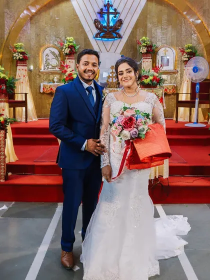 A beautiful portrait of a Christian couple inside the church. The bride's white gown and soft makeup look timeless and elegant.