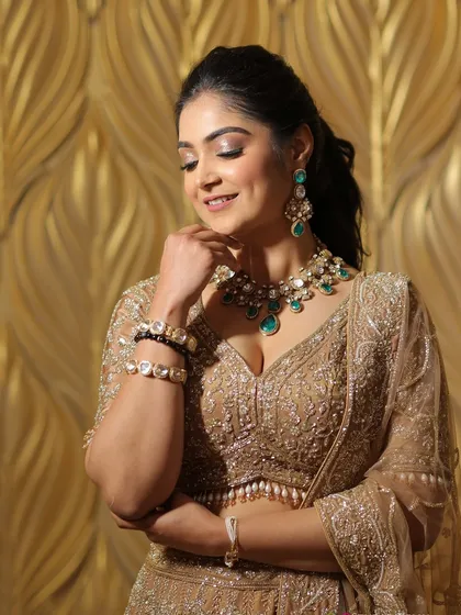The magic is in the details. A closer look at my engagement outfit shows how the right jewelry, like this emerald set, can elevate an entire look, adding a pop of color that beautifully frames the face.
