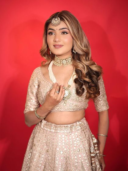 An ethereal day bride. This look features soft, highlighted skin and a classic winged liner, perfect for a daytime event.