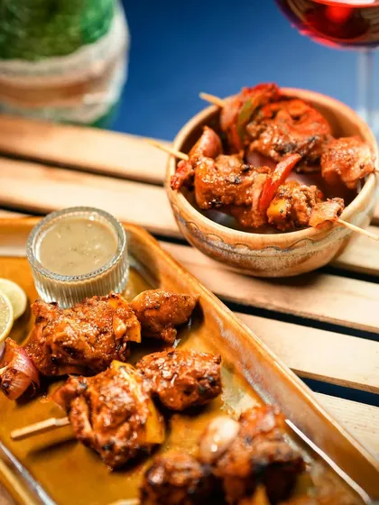 A closer view of the Murg Adani Boti, showcasing the char marks from the grill. This dish is a favorite for corporate events and private celebrations alike.