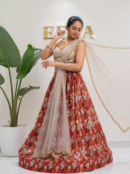 Bloom in elegance with this tulip flower georgette printed lehenga. I paired the floral skirt with a stunning thunder grey raw silk blouse, fully embroidered with gold zardozi for a perfect festive look.
