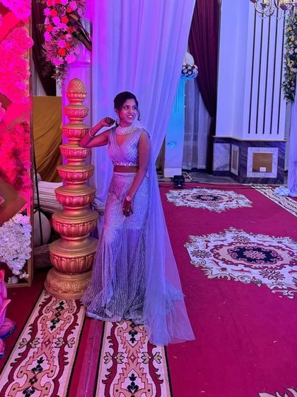 This enchanting grey fairytale lehenga is designed to make dreams come true. The shimmering sequin fabric catches the light beautifully, and the attached cape-like dupatta adds a touch of modern drama.