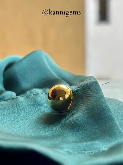 A true gentleman knows that details matter. These simple, polished gold ball cufflinks are more than an accessory, they are an extension of your style.
