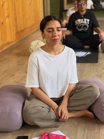 Finding inner peace through guided meditation. Participants in our journaling workshop close their eyes and connect with their intentions before putting pen to paper.