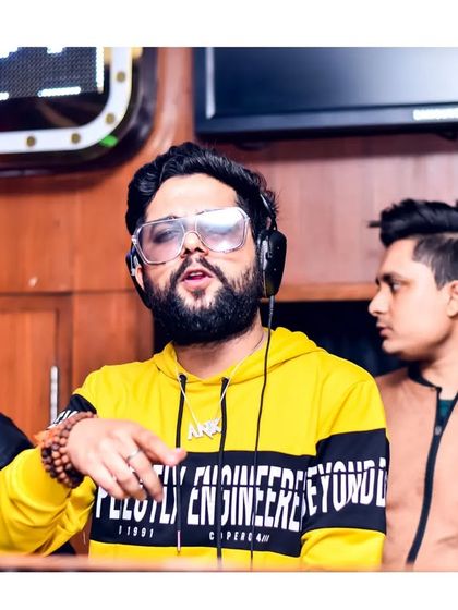 Interacting with the crowd from the DJ booth. I always make sure to connect with the people I'm playing for.