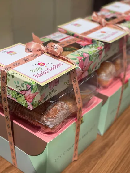 Getting a large corporate order ready for Raksha Bandhan. Each box is carefully packed and finished with a custom card and ribbon.
