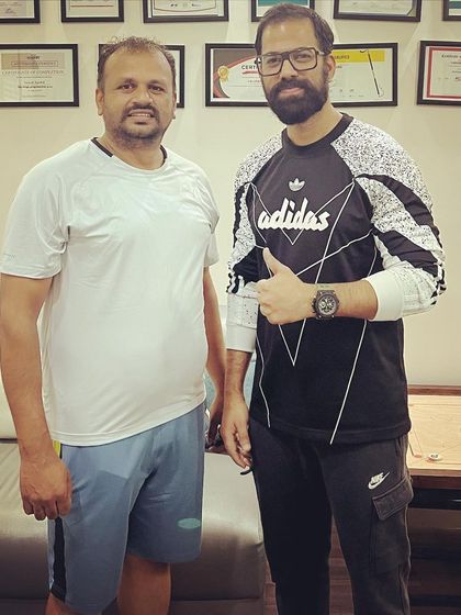 A picture of success. Standing with a happy client who has completed their program and achieved their goals is a moment of shared victory and a testament to the power of consistency and expert guidance.