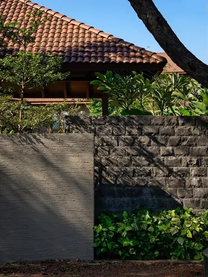 The play of light and shadow on a wall of textured stone and plaster. We consider how natural light will interact with the materials we choose, creating a dynamic visual experience throughout the day.