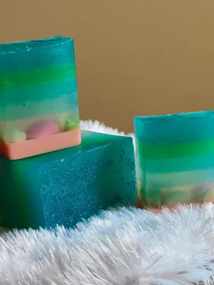 The ombre soap, cut into bars, revealing the seashell embeds at the bottom.