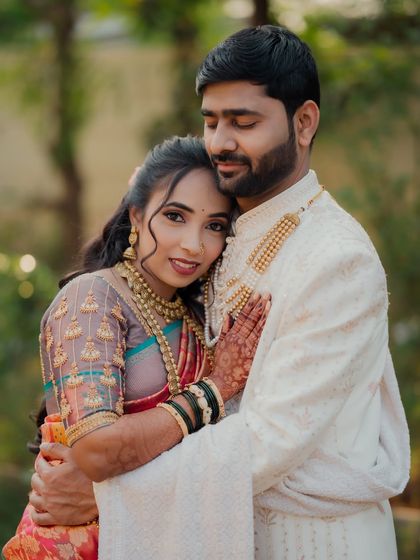 A heartwarming portrait of the couple in a gentle embrace. The bride leans against the groom, both with serene expressions, capturing a moment of peace and love.