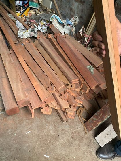 Salvaged and newly crafted wooden elements ready to be assembled for the balcony restoration.