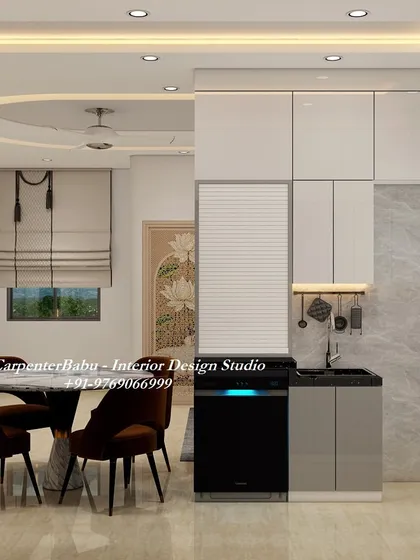 This kitchen and dining area are seamlessly integrated, perfect for modern living. The kitchen features handleless cabinets and a built-in dishwasher for a clean, minimalist look.