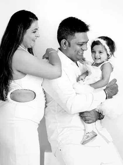 A beautiful black and white candid moment from a family photoshoot. This style is timeless and focuses purely on the emotion and connection between family members.