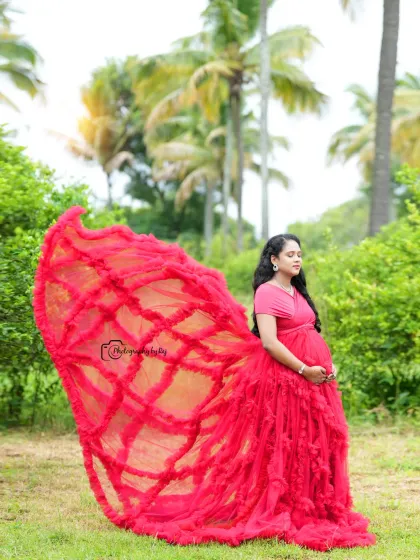 A dramatic flying gown shot with a red ruffled dress, creating a butterfly-like effect.