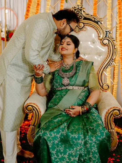 A tender moment between the parents-to-be during a traditional Sreemantham ceremony. I capture not just the rituals but also the quiet, loving interactions that make these events so special.